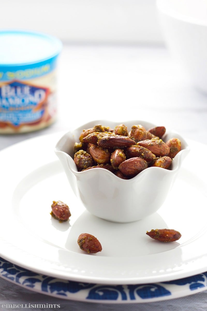 Pesto Roasted Almonds! These Pesto Roasted Almonds make the perfect snack, hostess gift and even appetizer for a party. They will be gone before you know it! www.Embellishmints.com
