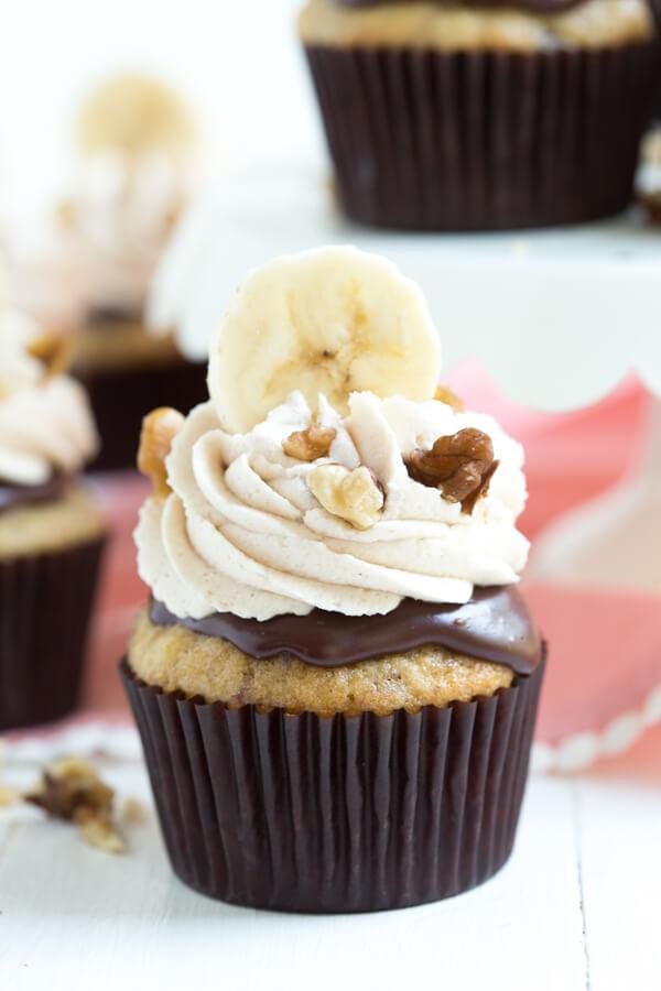 Chocolate Banana Nut Crunch Cupcakes from Spoonful of Flavor are made with a banana nut cake, chocolate ganache and topped with vanilla cinnamon frosting! My favorite from this weeks linky party on Embellishmints.com