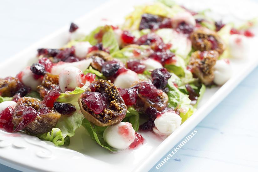 Fig Cranberry Mozzarella Caprese Salad will make a huge statement at your next party. Less than 5 ingredients, made in less than 30 minutes! You'll love it! www.Embellishmints.com