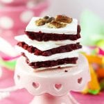 Red Velvet Truffle Bars taste just as amazing as Red Velvet Cake Balls but take half the time and don't require nearly as much skill. Check it out how our guest contributor Hilary, from Embellishmints, made these delicious treats!
